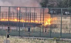 Alevlerin yanı başında futbol maçı devam etti