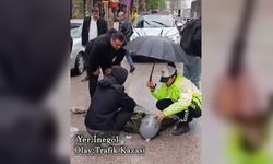 İçişleri Bakanı Çiftçi'den, yaralı gence şemsiye tutan trafik polisine teşekkür