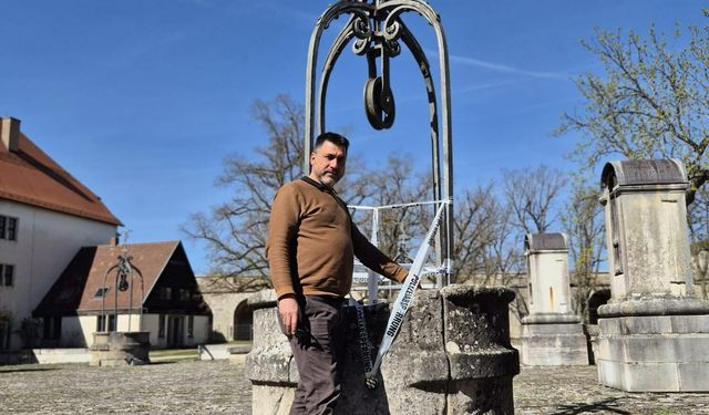 Almanya'da tarihi Wülzburg kalesinde 4 metre derinliğindeki su dolu sarnıca düşen çocuğu Balıkesirli Gündoğan kurtardı